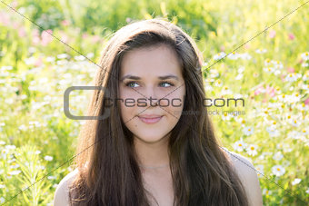 girl with beautiful long hair resting on nature