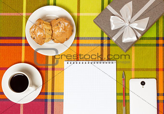 Coffee muffins smartphone on the table
