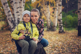Woman and her son with camera