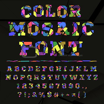 Broken colored alphabet on a dark background