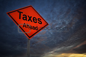Taxes Ahead warning road sign