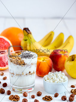 cottage cheese, yogurt, fruits and nuts vertical