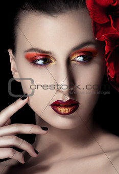 Beauty woman with flowers on black background