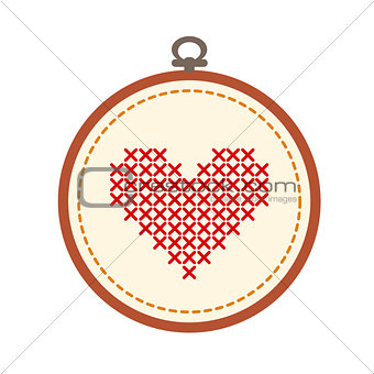 Embroidery hoop with heart isolated on white background.