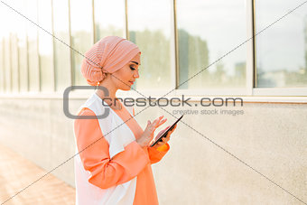 beautiful arabian girl with tablet computer