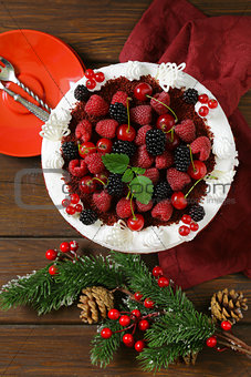 festive dessert Christmas cake with fresh berries