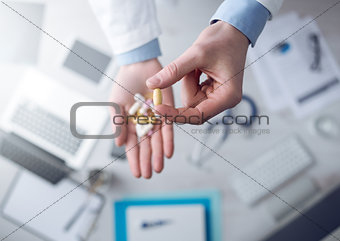 Doctor giving a lot of pills