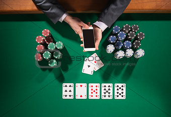 Poker player with smartphone