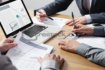 Business professionals analyzing financial data