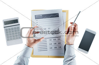 Business man checking a financial report