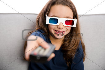 Girl holding a TV remote