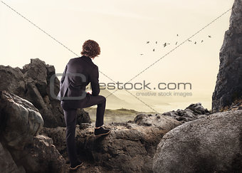 Relaxed businessman thinking about the future