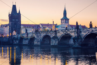 Prague city sunrise over Charles Bridge on Vltava river 
