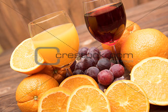 fresh orange and grape juice and fruits 