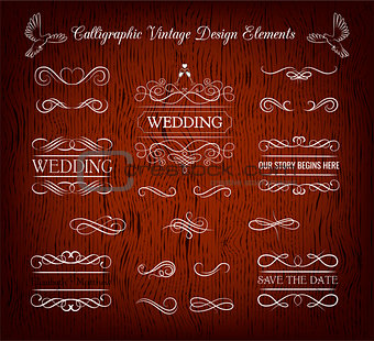 Vintage wedding elements and page decoration. Ornate frames and scroll element. Isolated on red wooden background