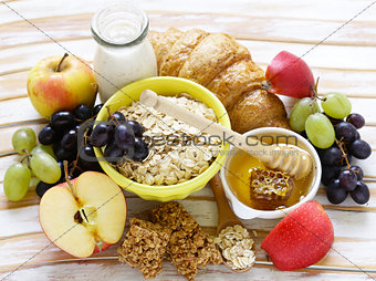 set of products for a healthy breakfast, oatmeal, fruit, honey