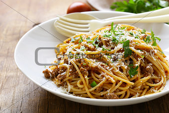 traditional pasta with Bolognese sauce with parmesan and herbs