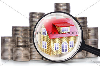Coins, a house and a magnifying glass