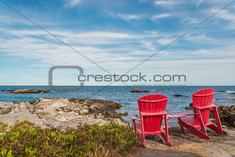 Red chairs facing Keji Seaside beach (South Shore, Nova Scotia, 