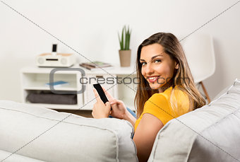 Happy woman texting