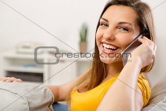 Young woman talking at phone