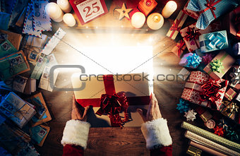 Santa opening a gift box