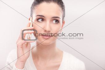 Pretty young woman having a phone call