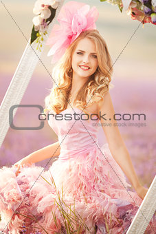 Beautiful young woman in the lavender fields.