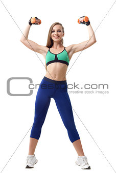 Beautiful trainer working out with small dumbbells isolated on white