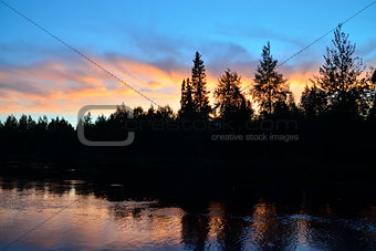 Romantic sunset on the river Pongoma. Karelia, Russia