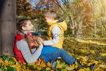 Kids having fun in autumn park