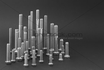 Various Isolated bolts on a dark background