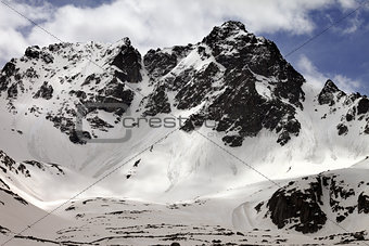 Snowy rocks with traces from avalanches