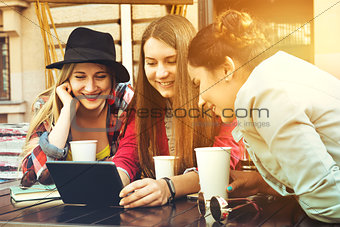 Group of girls friends coffee tablet