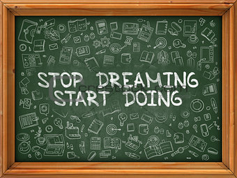 Hand Drawn Stop Dreaming Start Doing on Green Chalkboard.