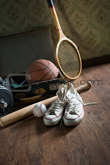 Vintage suitcase with sports equipment
