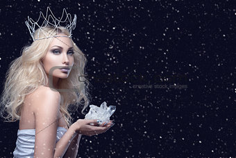 Beautiful girl crown holding crystal