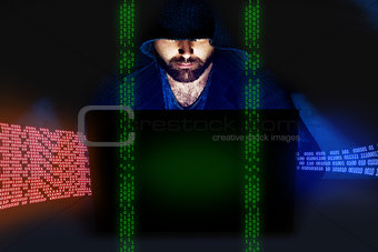 Man working at computer in dark room. Internet security concept
