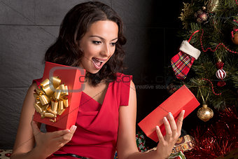 Woman opening a gift box.Christmas season