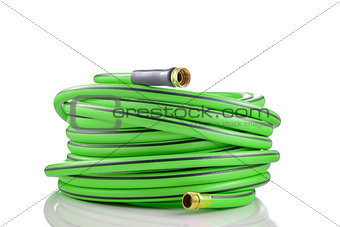 Long garden hose rolled-up isolated on white background