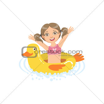 Girl In Water With Toy Duck Float