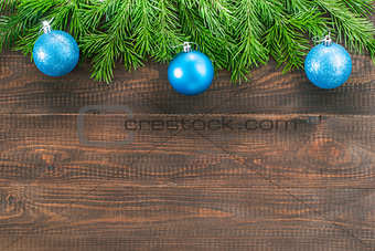 Christmas fir tree with decoration on wooden background
