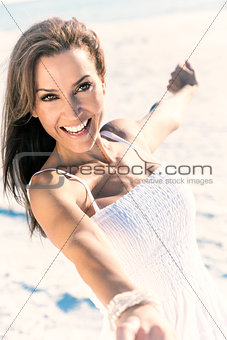 Beautiful Brunette Woman Laughing On A Beach