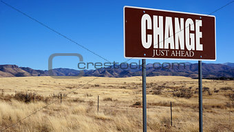 Change Just Ahead brown road sign