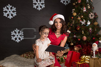 Smiling family with tablet pc.Christmas time
