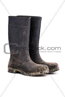 Dry dirty Mud boots isolated on white 3/4 view