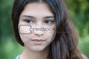 Portrait of beautiful girl looking to the side