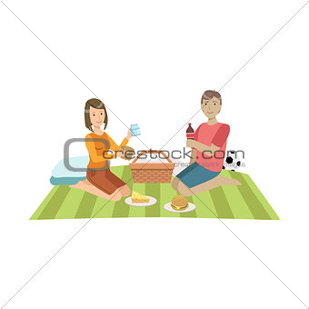 Couple On Picnic With Football Ball