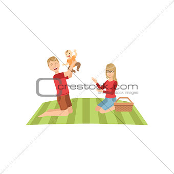Young Parents With Baby On Picnic