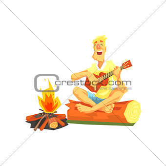 Guy Playing Guitar Sitting On A Log Next To Bonfire